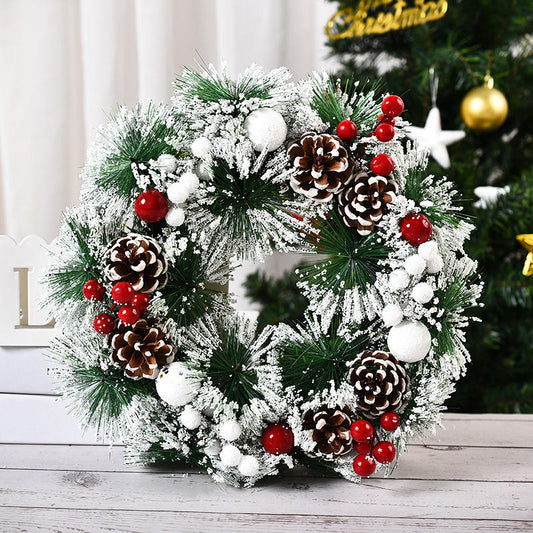 Artificial flocked christmas wreath with pine cones and christmas berries