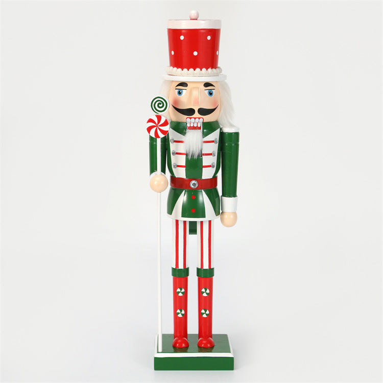 18 inch red and green christmas nutcracker soldier with lolly pop and candy cane wearing red hat and green vest and red boots
