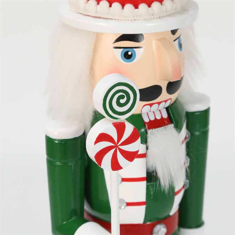 18 inch red and green christmas nutcracker soldier with lolly pop and candy cane wearing red hat and green vest and red boots-lolly pop candy closeup 