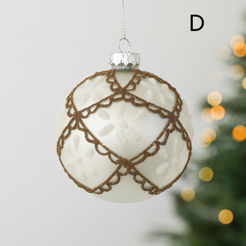 round christmas glass ornament ivory white colour with white decoration in a shape of 