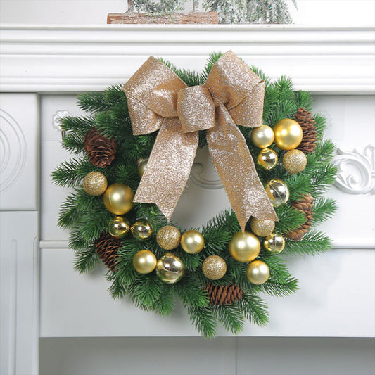 Golden bauble Christmas Wreath With gold bow and pine cone.