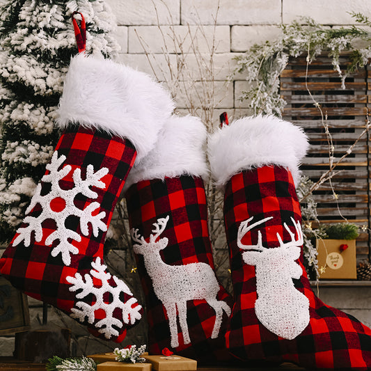 plaid red and white christmas stockings with reindeer and elk and snowflakes
