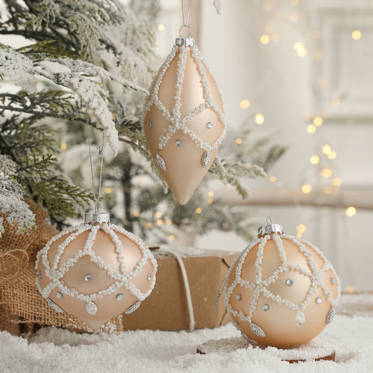 glass christmas ornament peach colour with white decoration