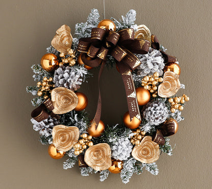 Front door Christmas wreath haven with ribbon and ornaments