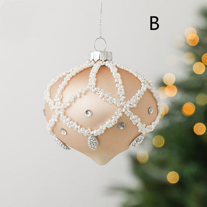 round christmas glass ornament peach colour with white decoration