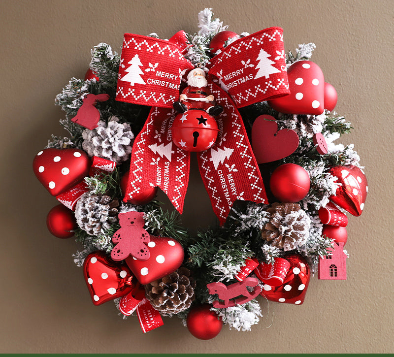 Front door Christmas wreath haven with ribbon and ornaments